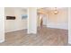 Spacious room with wood floors, transom windows and access to the foyer and dining room at 2496 Gristhaven Ln, Buford, GA 30519