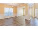 Inviting living room with wood floors, large window and open access to other rooms at 2496 Gristhaven Ln, Buford, GA 30519