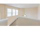 Well-lit stairwell with ceiling fan and natural light from windows at 2496 Gristhaven Ln, Buford, GA 30519