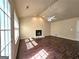 Spacious living room featuring a fireplace, ceiling fan and beautiful wood flooring at 3053 Herscu Way, Stonecrest, GA 30038