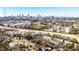 Aerial view of townhomes with the city skyline and busy highway in the background on a sunny day at 1126 Village Se Ct, Atlanta, GA 30316