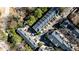 Aerial view of townhome rooftops showing the architectural details and surrounding trees in a well maintained community at 1126 Village Se Ct, Atlanta, GA 30316
