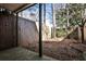 Fenced backyard with trees and wooded view at 1126 Village Se Ct, Atlanta, GA 30316
