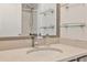 Bathroom featuring a modern sink, frameless shower and decorative shelves in a neutral palette at 1126 Village Se Ct, Atlanta, GA 30316