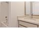 Bathroom featuring a tub shower and a vanity with stainless fixtures, a large mirror and neutral walls at 1126 Village Se Ct, Atlanta, GA 30316