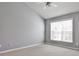 Vaulted ceiling bedroom featuring neutral decor, carpet, and a large window with natural light at 1126 Village Se Ct, Atlanta, GA 30316