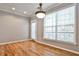 Bright dining room with hardwood floors, a light fixture, neutral paint and a large sunny window at 1126 Village Se Ct, Atlanta, GA 30316