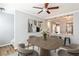 Open-concept dining area featuring hardwood floors, modern art, and a view into the kitchen at 1126 Village Se Ct, Atlanta, GA 30316