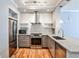 Updated kitchen features stainless steel appliances, granite countertops, modern fixtures, and subway tile backsplash at 1126 Village Se Ct, Atlanta, GA 30316