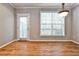 Bright open living room with hardwood floors, neutral decor, and a back patio door at 1126 Village Se Ct, Atlanta, GA 30316