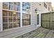 Rear patio featuring wood decking and access to the exterior of the home at 1126 Village Se Ct, Atlanta, GA 30316