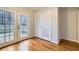 Sunlit living room with hardwood floors and glass doors leading to the backyard at 2248 Greenway Drive, Decatur, GA 30035