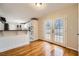 Living room adjacent to kitchen with breakfast bar and patio access at 2248 Greenway Drive, Decatur, GA 30035