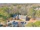 Aerial view showing a multifamily building, wooded area, parking, and mature trees at 2937 Torreya Way, Marietta, GA 30067