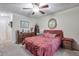 Inviting bedroom with a ceiling fan and elegant dresser with mirror at 2937 Torreya Way, Marietta, GA 30067