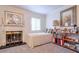 Bright bedroom featuring a cozy daybed, fireplace, decorative accents, and carpeted flooring at 2937 Torreya Way, Marietta, GA 30067