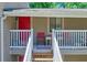 Upstairs front porch and entrance with a red door and chairs for relaxing at 2937 Torreya Way, Marietta, GA 30067