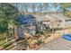 Exterior view of the building, with trees, grass, landscaping, parking and a blue car at 2937 Torreya Way, Marietta, GA 30067