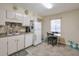 Well-lit kitchen featuring updated appliances, cabinetry, and tile backsplash at 2937 Torreya Way, Marietta, GA 30067