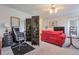 Cozy living room featuring a comfortable red sofa, office space and stylish decor at 2937 Torreya Way, Marietta, GA 30067