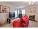 Cozy living room featuring a fireplace, neutral walls, plush seating, and lots of natural light at 2937 Torreya Way, Marietta, GA 30067