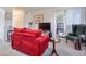 Comfortable living room with sliding door, red sofa, and an abundance of space at 2937 Torreya Way, Marietta, GA 30067