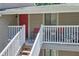 Welcoming porch with red door, seating area, and ample natural light at 2937 Torreya Way, Marietta, GA 30067