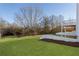 A lush backyard with a manicured lawn and view of a wooded area from the rear of the property at 364 Poplar Springs Rd, Hiram, GA 30141