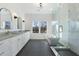 Bathroom featuring double vanity, shower, soaking tub and grey tile floor at 364 Poplar Springs Rd, Hiram, GA 30141