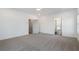 Bright bedroom with gray carpet, ceiling fan, and white walls at 364 Poplar Springs Rd, Hiram, GA 30141