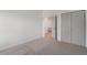 Carpeted bedroom showcasing double door closet and hallway access at 364 Poplar Springs Rd, Hiram, GA 30141
