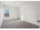 This bedroom features carpet, a window, and ample space at 364 Poplar Springs Rd, Hiram, GA 30141