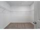 Walk-in closet features a carpeted floor and wire shelving system at 364 Poplar Springs Rd, Hiram, GA 30141