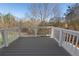 View of deck with white railing overlooking a wooded area at 364 Poplar Springs Rd, Hiram, GA 30141