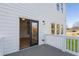 Exterior of home with white siding featuring a deck and black framed sliding door at 364 Poplar Springs Rd, Hiram, GA 30141