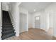 Bright foyer features hardwood floors and an open staircase, creating a welcoming and spacious entrance to the home at 364 Poplar Springs Rd, Hiram, GA 30141