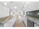 Open-concept kitchen featuring stainless steel appliances, granite countertops, and abundant natural light at 364 Poplar Springs Rd, Hiram, GA 30141