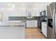 Spacious kitchen with stainless steel appliances and countertops, ideal for cooking and entertaining at 364 Poplar Springs Rd, Hiram, GA 30141