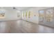 Bright and airy living room with hardwood floors, featuring large windows and a glass patio door for seamless indoor-outdoor living at 364 Poplar Springs Rd, Hiram, GA 30141