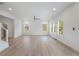 Bright and airy living room features hardwood floors and large windows, offering ample natural light at 364 Poplar Springs Rd, Hiram, GA 30141