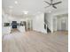 Open concept living area with hardwood floors that connects to a modern kitchen with an island and barstool seating at 364 Poplar Springs Rd, Hiram, GA 30141