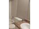 Tidy bathroom features a shower-tub combo, white tile, and a vanity with neutral countertop at 4952 Isle Royal Ct, Stone Mountain, GA 30088