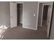 Neutral painted room features an open closet and carpet, creating a clean, versatile space at 4952 Isle Royal Ct, Stone Mountain, GA 30088