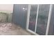 Private patio area with sliding glass doors offering easy access to outdoor relaxation and fresh air at 4952 Isle Royal Ct, Stone Mountain, GA 30088