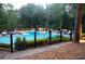 Community pool with a stage for entertainment and plenty of seating for residents to enjoy at 4952 Isle Royal Ct, Stone Mountain, GA 30088