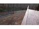 Wooden deck overlooking the lake and scenic path at 8155 Stone Hill Rd, Cumming, GA 30028