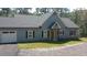 Charming exterior of a single story home, featuring a gabled entryway and attached garage at 8155 Stone Hill Rd, Cumming, GA 30028