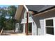 Exterior view featuring a spacious deck and many windows at 8155 Stone Hill Rd, Cumming, GA 30028