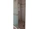 Tiled standing shower with glass door and built in shelving at 8155 Stone Hill Rd, Cumming, GA 30028