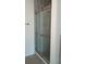Shower with marbled tiling and sliding glass door at 8155 Stone Hill Rd, Cumming, GA 30028